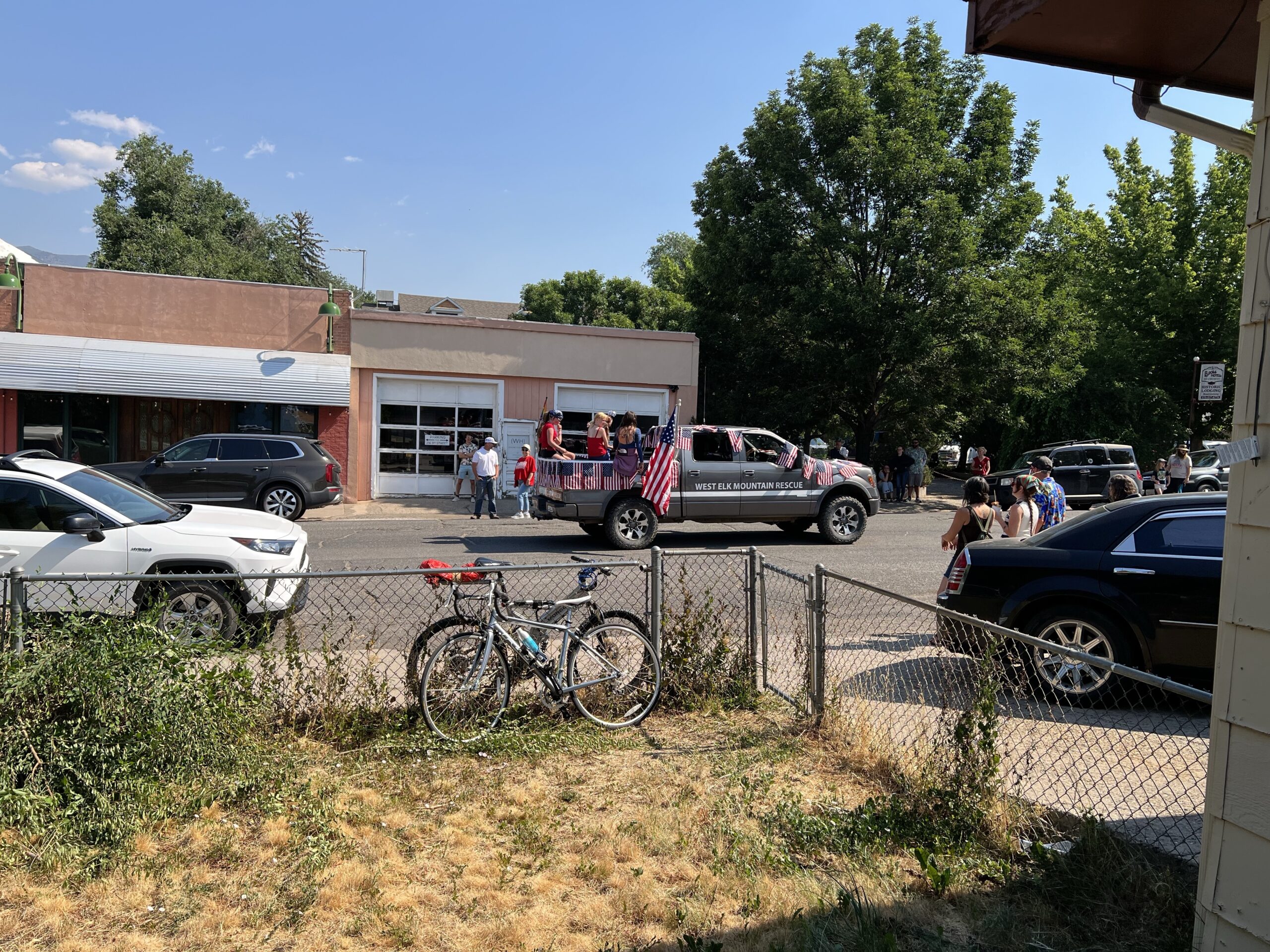 A parade passes by on the road.